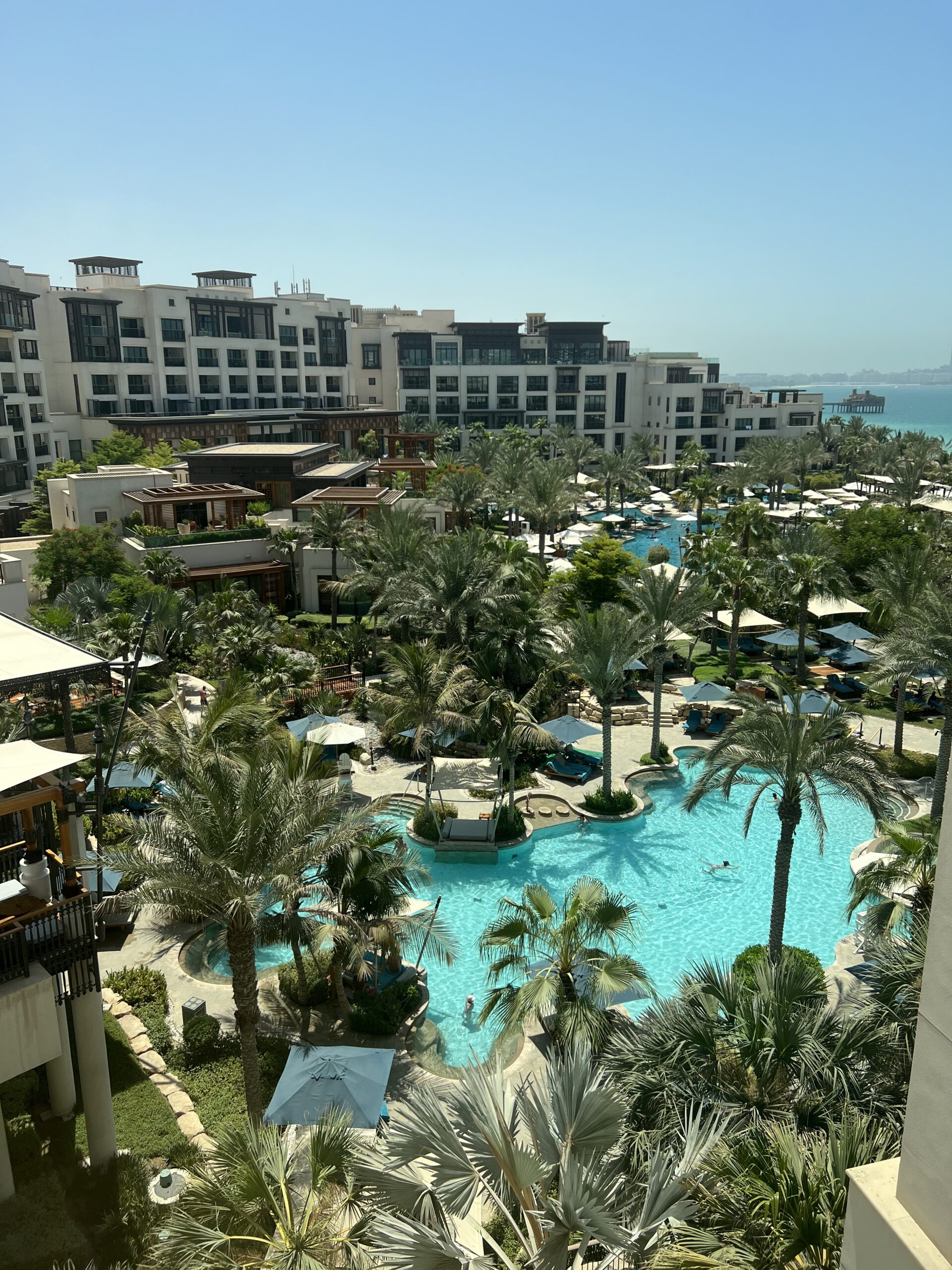 Jumeirah Al Naseem gardens and pool with the Burj Al Arab beyond, Madinat Jumeirah Dubai