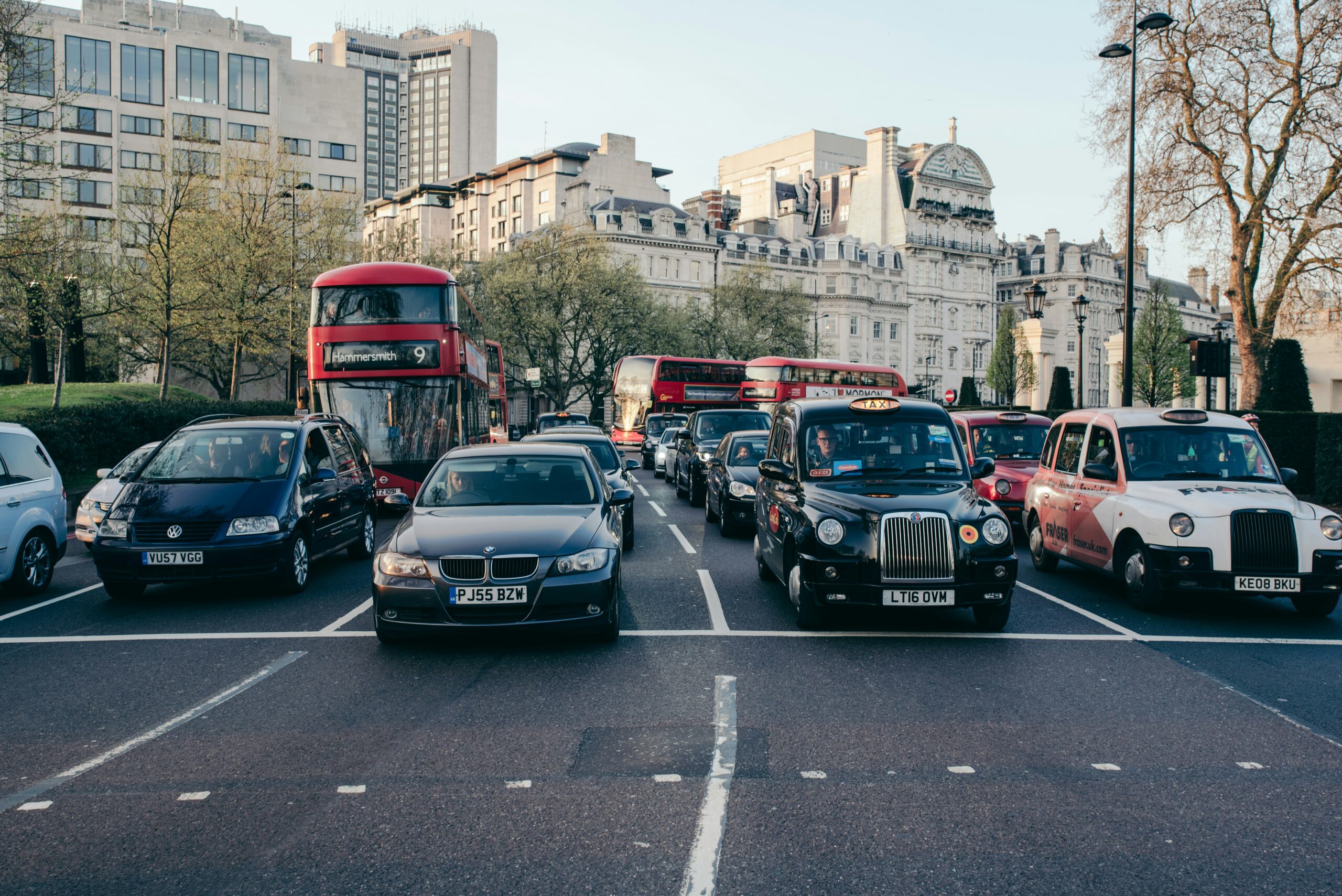 Cars queuing in slow traffic on a grey UK road